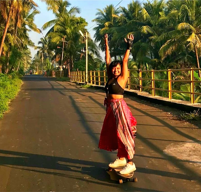 Girl skateboarding on most scenic routes of mumbai